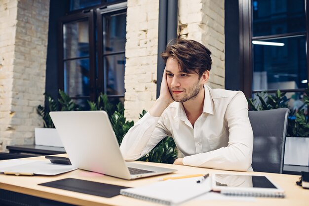 Businessman working on laptop in office