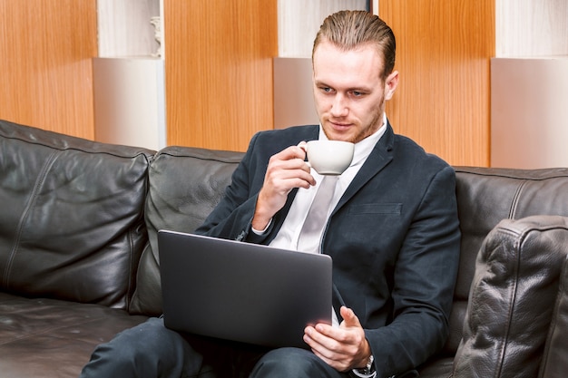 Businessman working on notebook computer at office
