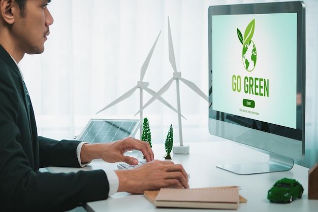 businessman working in office developing plan on alternative energy gyre