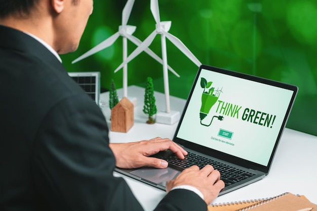Businessman working in office developing plan on alternative energy gyre