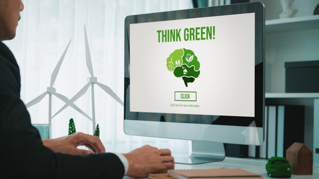Businessman working in office developing plan on alternative energy Gyre
