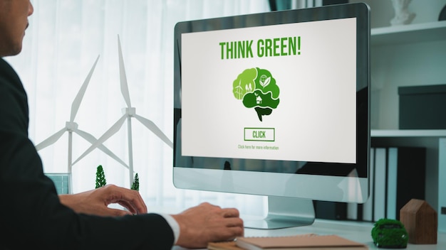 Businessman working in office developing plan on alternative energy Gyre