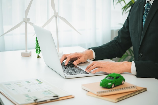 Businessman working in office developing plan on ev car Gyre