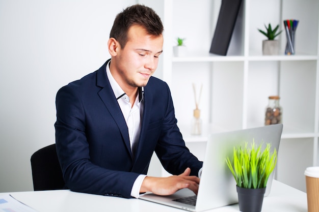 Businessman working in the office at laptop