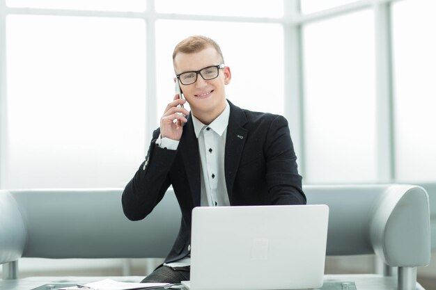 Businessman working sitting in the lobby of the business center