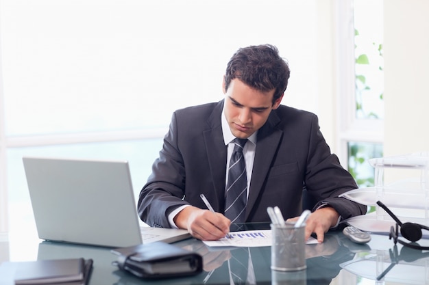 Businessman working on statistics