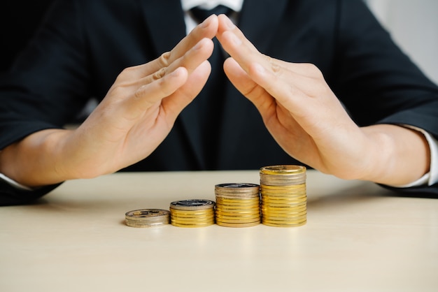 Businessman working with coin money currency.