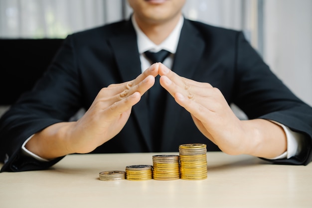 Businessman working with coin money currency.