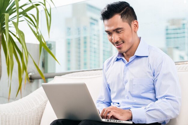 Businessman working with laptop from home