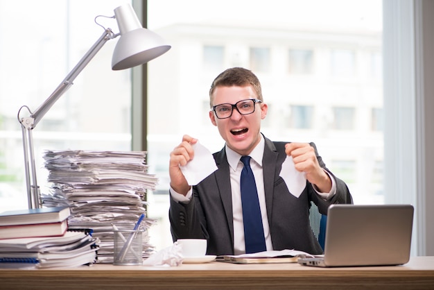 Businessman working with much paperwork