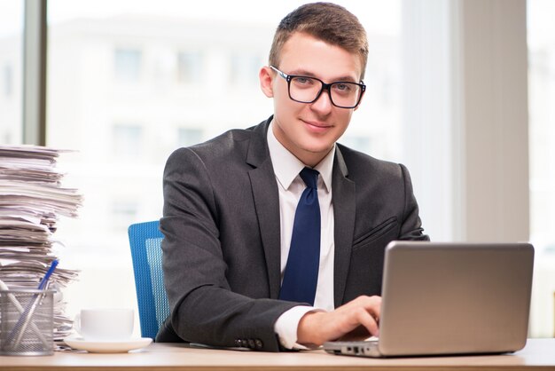 Businessman working with much paperwork