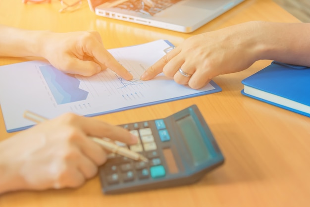 Businessman working with sheet analysis charts.