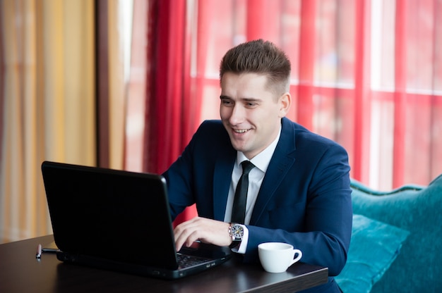 Businessman works with laptop