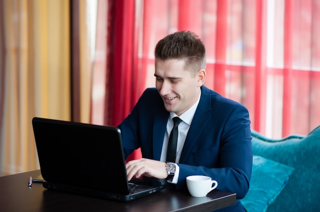 Businessman works with laptop