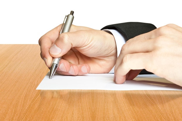 Photo businessman writes a pen on an empty paper