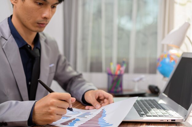 Businessman writing documents signing documents