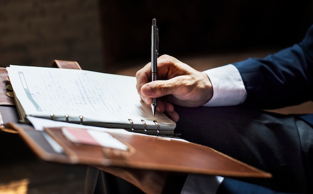 Businessman writing a note