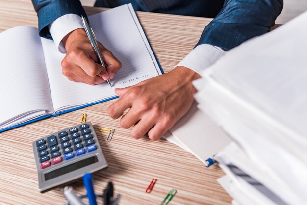 Businessman writing report in the office