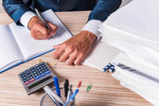 Businessman writing report in the office