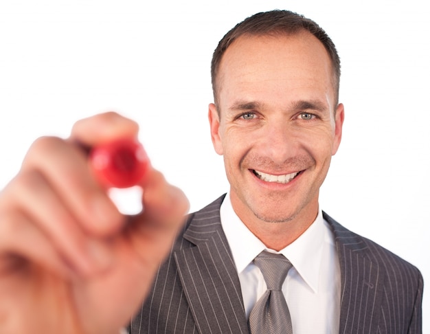 Businessman writing something with a red marker pen