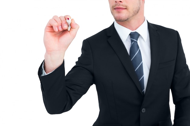 Businessman writing with a marker