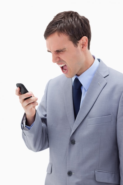 Businessman yelling at his cellphone