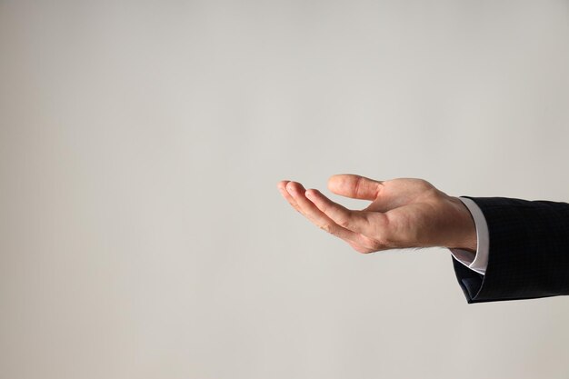 Businessmans hand closeup on a white background