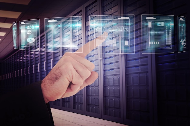 Businessmans hand pointing in suit jacket against server room