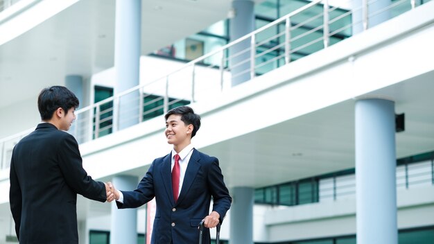 Businessmans handshake. successful businessmen handshaking after good deal. business partnership meeting concept.