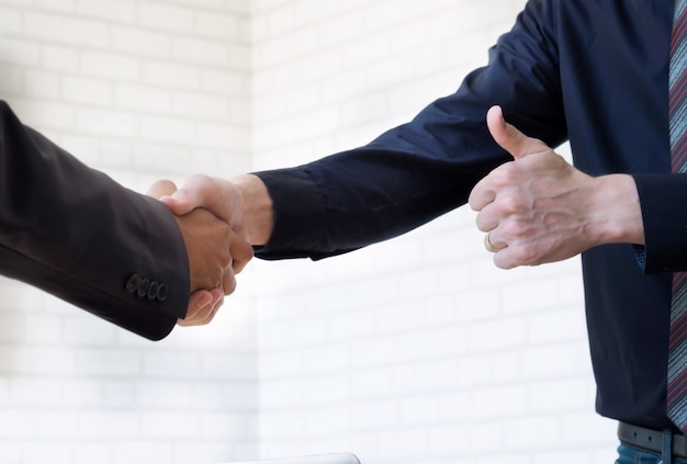 Businessmans handshake.