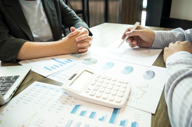 Photo businessmen are checking the financial to prepare the company to develop abroad.