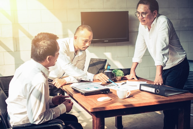 Businessmen are meeting in the office.