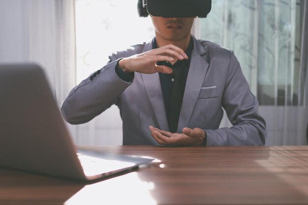 Businessmen are using virtual reality glasses in the virtual metaverse world.