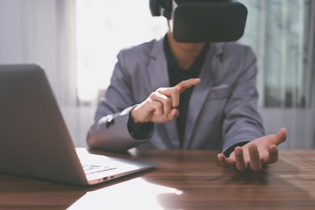 Businessmen are using virtual reality glasses in the virtual metaverse world.