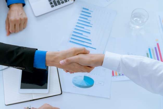 Businessmen closing a deal by shaking hands