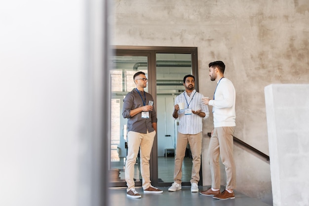 businessmen drinking coffee and water at office