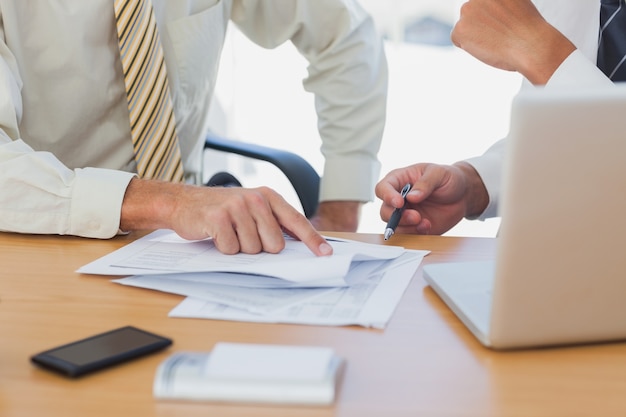 Businessmen going over paperwork