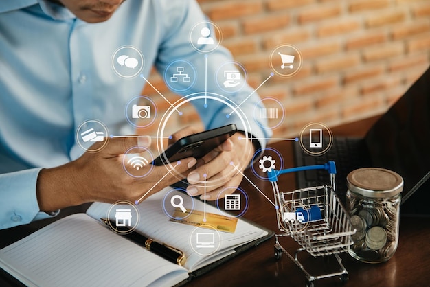 Businessmen hand holding smartphone tablet and using credit card for online shoppingOnline shopping concept