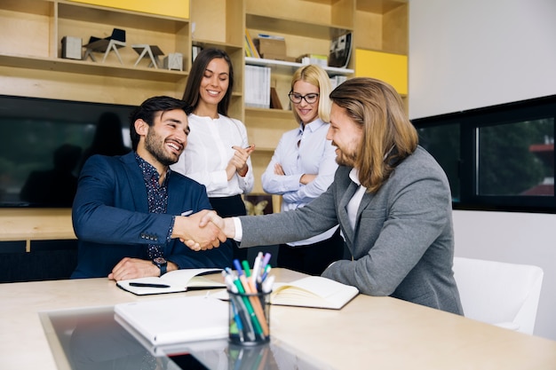 Businessmen handshaking after deal agreement