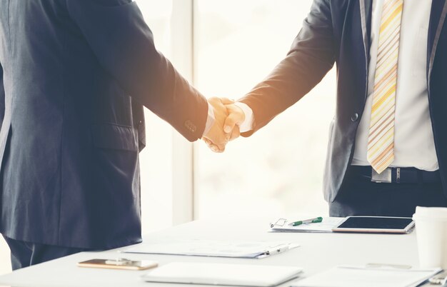 Businessmen making handshake in the city 