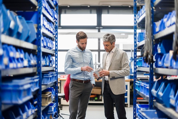 Businessmen during meeting in storage