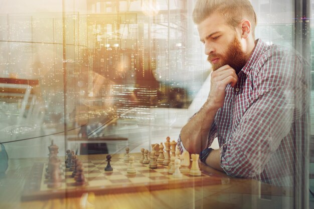 Businessmen play chess as strategy and tactic concept