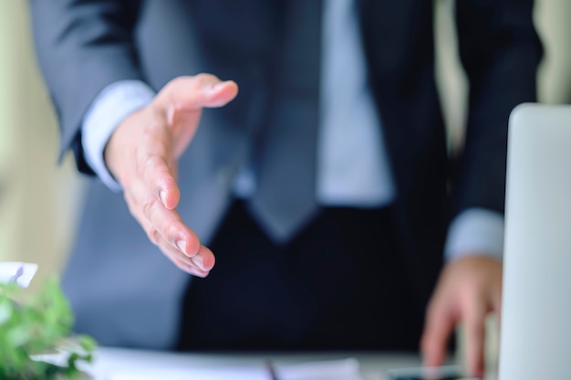 businessmen reaching out  hand for shacking.