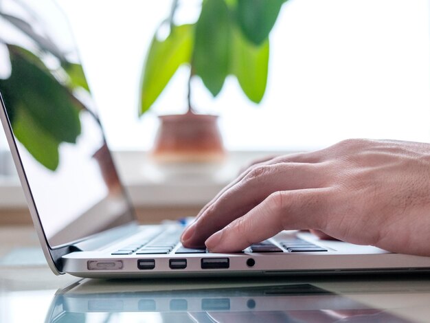 Businessmen's hands typing on laptop