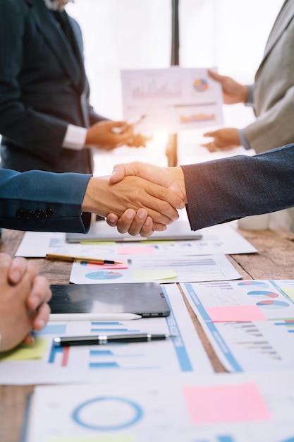 Businessmen shake hands after agreeing to start a new project successfully