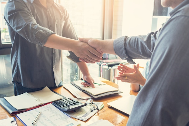 Businessmen shake hands after meeting