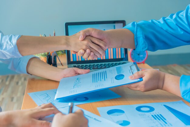 Businessmen shaking hands during a meeting