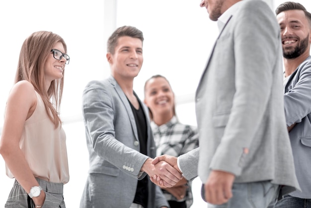 Businessmen shaking hands Two confident businessmen shaking hands and smiling