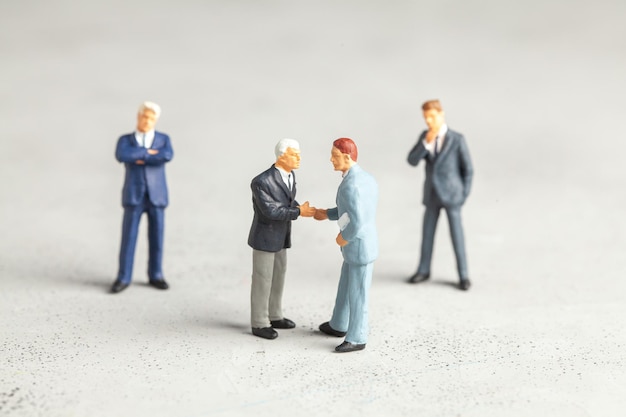 Businessmen in suits shake hands. Contract or successful deal concept.