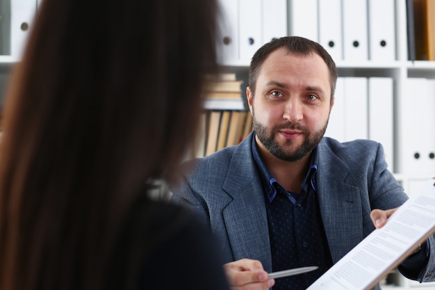 Businessmen talking with woman